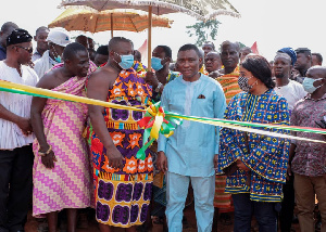 George Mireku Duker performing the ribbon cutting ceremony