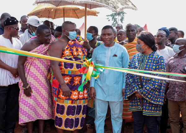 George Mireku Duker performing the ribbon cutting ceremony