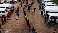 Locals are seen during the distribution of food amid the spread of the coronavirus disease