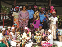 Mrs. Rebecca Akufo-Addo (second from left) in a group photograph with the kayayei