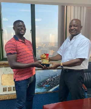 Coach Boadu (left) presents his award to club owner Togbe Afede