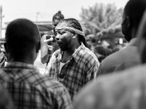 Edem interacting with some individuals during his visit to the Volta Region