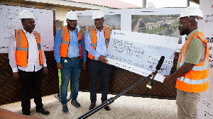 Officials Maranatha Oil Services Limited presenting the cheque