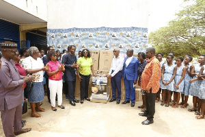 Alumni members with some staff making the presentation as some students look on