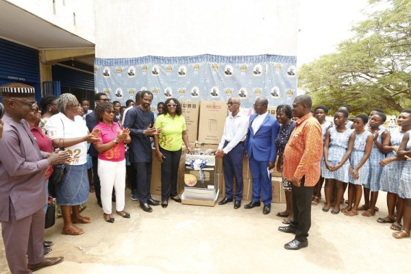 Alumni members with some staff making the presentation as some students look on