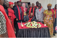 McDan signing the book of condolence in memory of the late Ga Manye