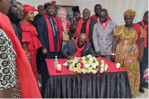 McDan signing the book of condolence in memory of the late Ga Manye