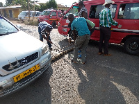 Some people fixing faulty cars