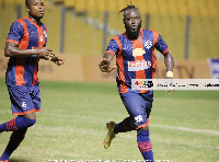 Legon Cities striker, Hans Kwofie(R)