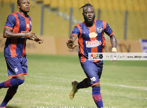 Legon Cities striker, Hans Kwofie(R)