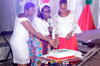 Mrs Barbaro Oduro-Toku (L) cutting the cake with Pastor Rita Ampofo ICGC, Hosanna Temple (Middle)