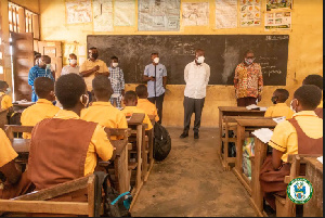 Mohammed Adjei Sowah, Chief Executive of Accra Metropolitan,(in white) interacting with the pupils