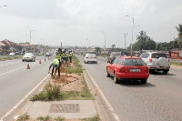 A photograph of the vehicles moving on the street