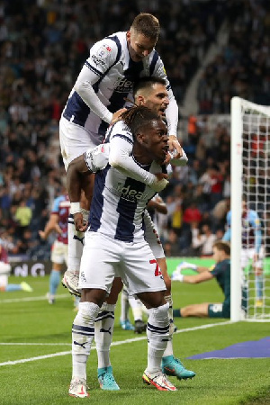 Brandon Thomas-Asante is joined by teammates to celebrate his goal