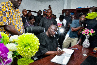 Dr. Mahamudu Bawumia signing the book of condolence