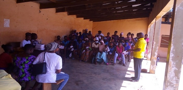 Samuel Atando Akolgo, Acting Garu District Director of the NCCE speaking to the people