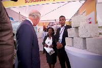 Prince CHarles talking to some staff of FanMilk