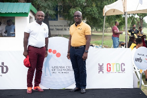 Kwadwo Antrim, CEO of the GTDC, and Nana Kwadwo Benneh, CEO of UMB on the winner's dais at the event