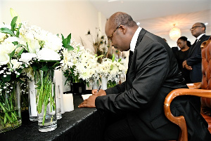 BoG Governor, Dr. Ernest Addison signing the book of condolence