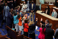 Lawmakers celebrate after passage of the law