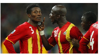 Stephen Appiah speaking to Asamoah Gyan during the World Cup game against Uruguay