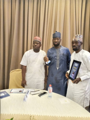 Alhaji Salamu Amadu flanked by some staff members of Afro-Arab Microfinance