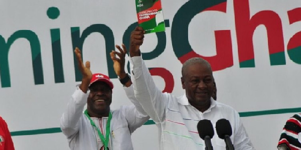 Mahama holding the Green Book