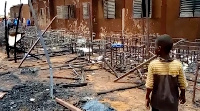 This video screengrab shows burned chairs, tables and other objects in the school