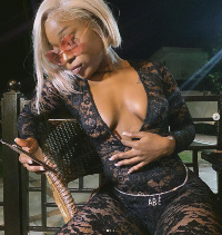 Efia Odo in a black lace dress