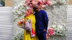 Gifty Adorye kissing her husband