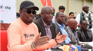 Sports Cabinet Secretary Ababu Namwamba (L) address journalists in Kericho County, Kenya