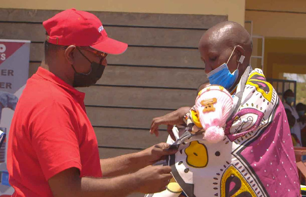 Yash Deb attending to a child