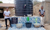 Some Tsavana residents standing by the new portable water