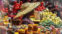 File Photo: A trader sitting by her wares