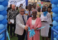 Dr Marwan (left) and Ms Wane cutting the tape to open the facility