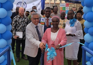 Dr Marwan (left) and Ms Wane cutting the tape to open the facility