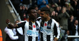 Christian Atsu and a team mate celebrate victory