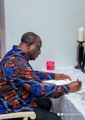 Trades and Industry Minister, Alan Kyerematen signing the book of condolence