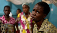 A Congolese victim of ethnic violence rests inside a ward at the General Hospital in Bunia