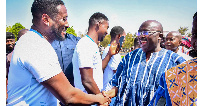 Vice President Dr. Mahamudu Bawumia and Asamoah Gyan in a handshake