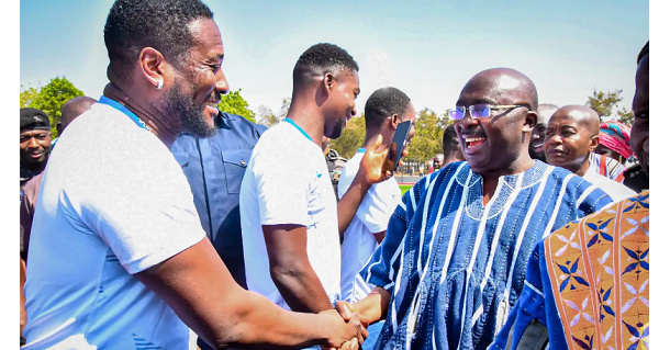 Vice President Dr. Mahamudu Bawumia and Asamoah Gyan in a handshake