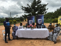 Bennet Frimpong, left, presenting the items