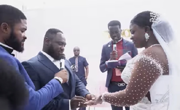 Tracey Boakye and husband, Frank Badu Ntiamoah exchanging vows