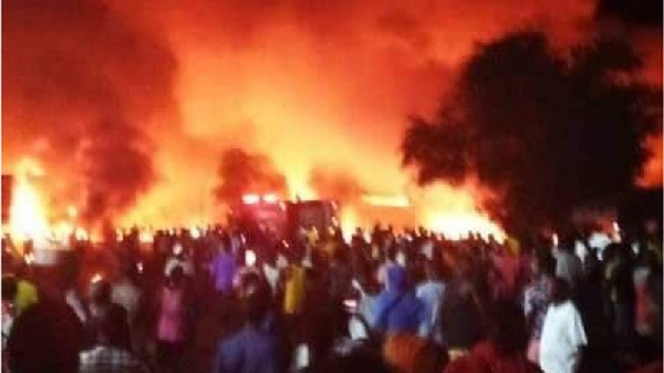 At least 91 pipo don die afta one massive explosion wen fuel tanker collide wit one lorry