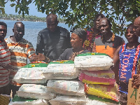 Ada East MP, Comfort Doyoe Cudjoe (in black) presenting the items to affected residents