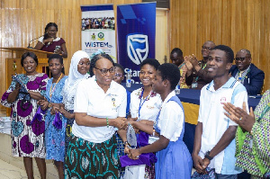 Prof Mbok Oduro presenting prizes to the winners