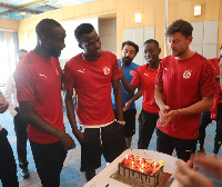 Cofie (second left) surrounded by tean mates on his 30th birthday