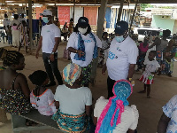 Mrs. Yaa Pokuaa Baiden (Middle) interacting with people at a registration centre