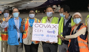 A joint WHO and UNICEF team welcome COVAX shipment in The Gambia