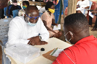 Member of Parliament for Ellembelle, Emmanuel Armah Kofi-Buah going through the registration process